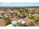 Expansive aerial view showcasing a home with desert landscaping and large circular driveway at 4187 E Triple Crown Dr, San Tan Valley, AZ 85140