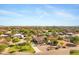 This aerial view shows a well-maintained home with mature landscaping, and circular driveway at 4187 E Triple Crown Dr, San Tan Valley, AZ 85140