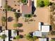 Expansive aerial view of property featuring a large horse area, lush landscaping, and mature trees at 4187 E Triple Crown Dr, San Tan Valley, AZ 85140