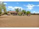 Backyard featuring spacious covered patios, desert landscaping and equestrian facilities at 4187 E Triple Crown Dr, San Tan Valley, AZ 85140