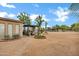 Backyard view, highlighting a patio area with an outdoor seating and a view of the horse arena at 4187 E Triple Crown Dr, San Tan Valley, AZ 85140