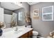 Bathroom featuring a wood vanity, neutral walls, decorative accents, and a mirror at 4187 E Triple Crown Dr, San Tan Valley, AZ 85140