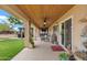 Covered patio with wood ceiling, ceiling fans, and an outdoor seating area at 4187 E Triple Crown Dr, San Tan Valley, AZ 85140