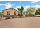 Exterior shot of the house with desert landscaping and an American flag at 4187 E Triple Crown Dr, San Tan Valley, AZ 85140