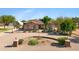 Charming single-story home featuring desert landscaping, a circular driveway, and a tile roof at 4187 E Triple Crown Dr, San Tan Valley, AZ 85140