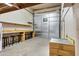 Garage with a refrigerator, a workbench, overhead lighting, and ample space for storage or projects at 4187 E Triple Crown Dr, San Tan Valley, AZ 85140