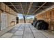 Large covered garage space with a door to the outside, perfect for storage of vehicles or equipment at 4187 E Triple Crown Dr, San Tan Valley, AZ 85140