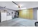 Spacious garage with built-in storage cabinets and room for vehicles at 4187 E Triple Crown Dr, San Tan Valley, AZ 85140