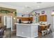Bright, eat-in kitchen featuring stainless steel appliances, a breakfast bar, and ample cabinet space at 4187 E Triple Crown Dr, San Tan Valley, AZ 85140