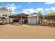 Outbuilding with metal roof, storage shed and RV parking area under a metal roof on a spacious lot at 4187 E Triple Crown Dr, San Tan Valley, AZ 85140