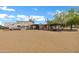 View of the outbuilding and RV parking area with RV, storage shed, and animal shelter on spacious lot at 4187 E Triple Crown Dr, San Tan Valley, AZ 85140