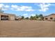 Expansive lot featuring a barn, parking for multiple RV's, with mature landscaping at 4187 E Triple Crown Dr, San Tan Valley, AZ 85140