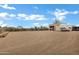 Wide view of the property lot showing the RV parking, storage shed and desert landscaping at 4187 E Triple Crown Dr, San Tan Valley, AZ 85140