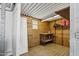 Interior of shed with plywood walls, shelves, a workbench, storage, and a small window at 4187 E Triple Crown Dr, San Tan Valley, AZ 85140