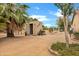 Exterior shot of a charming shed surrounded by trees and desert landscaping at 4187 E Triple Crown Dr, San Tan Valley, AZ 85140