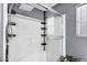 Modern walk-in shower featuring a rainfall shower head and built-in shelving at 4187 E Triple Crown Dr, San Tan Valley, AZ 85140