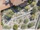 Aerial perspective showcasing the property's tile roof, water feature, and landscaped grounds at 4747 E Arroyo Verde Dr, Paradise Valley, AZ 85253