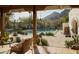 Inviting backyard featuring a sparkling pool, lush landscaping, and mountain views at 4747 E Arroyo Verde Dr, Paradise Valley, AZ 85253