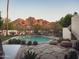 Serene backyard pool area with desert landscaping and views of the mountains in the background at 4747 E Arroyo Verde Dr, Paradise Valley, AZ 85253