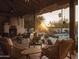 Relaxing backyard patio with comfortable seating and a view of the sparkling pool at sunset at 4747 E Arroyo Verde Dr, Paradise Valley, AZ 85253