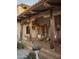 Charming backyard patio with overhead beams, comfortable seating, and beautiful desert landscaping at 4747 E Arroyo Verde Dr, Paradise Valley, AZ 85253