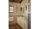 Bathroom with double sinks, window with wood shutters and artistic tile accents at 4747 E Arroyo Verde Dr, Paradise Valley, AZ 85253