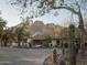 Charming home with beautiful landscaping, featuring a tile roof and set against a backdrop of scenic mountains at 4747 E Arroyo Verde Dr, Paradise Valley, AZ 85253