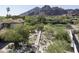 Expansive estate showing the meticulously landscaped grounds, water feature, and outdoor gathering spaces at 4747 E Arroyo Verde Dr, Paradise Valley, AZ 85253