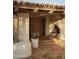 Charming entryway with a carved wood front door, terracotta tile and desert landscaping at 4747 E Arroyo Verde Dr, Paradise Valley, AZ 85253