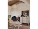 Cozy living room with fireplace, seating area, and rustic decor at 4747 E Arroyo Verde Dr, Paradise Valley, AZ 85253