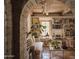 Charming living room with built-in bookshelves, stylish decor, and an archway at 4747 E Arroyo Verde Dr, Paradise Valley, AZ 85253