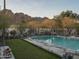 Backyard oasis features a pool with mountain views, desert landscape, and lush green lawn at 4747 E Arroyo Verde Dr, Paradise Valley, AZ 85253