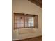 Cozy window seat offering views of brick walls and desert landscape with shutters at 4747 E Arroyo Verde Dr, Paradise Valley, AZ 85253