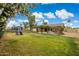 A beautiful back yard with lush grass, a patio and climbing vines at 4854 E Evergreen St, Mesa, AZ 85205