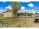 Spacious backyard featuring a covered patio and play area, perfect for outdoor entertaining at 4854 E Evergreen St, Mesa, AZ 85205