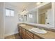This spacious bathroom features double sinks, a shower, and great lighting at 4854 E Evergreen St, Mesa, AZ 85205