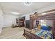 A cozy bedroom with hardwood floors and custom-built wooden bunk beds at 4854 E Evergreen St, Mesa, AZ 85205