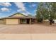 Charming single-story home with brick facade, neutral gravel landscaping, and mature shade tree at 4854 E Evergreen St, Mesa, AZ 85205