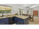Kitchen featuring granite countertops, updated cabinets and appliances, and backyard views at 4854 E Evergreen St, Mesa, AZ 85205