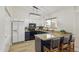 Well-lit kitchen with island seating, granite counters, and modern appliances at 4854 E Evergreen St, Mesa, AZ 85205