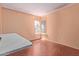 Bright bedroom with hardwood floors and a corner window offering natural light at 5923 W Mauna Loa Ln, Glendale, AZ 85306