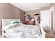 This bedroom has a bed, a closet, and a chest of drawers at 5923 W Mauna Loa Ln, Glendale, AZ 85306
