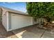 Single Gathering home with a two-car garage, mature trees and covered entry way at 5923 W Mauna Loa Ln, Glendale, AZ 85306