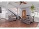Open living room with staircase, wood flooring, and front door entryway at 5923 W Mauna Loa Ln, Glendale, AZ 85306