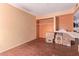 Room with hardwood floors and closet with stored items at 5923 W Mauna Loa Ln, Glendale, AZ 85306