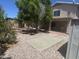 Landscaped backyard featuring a patio, rock garden, and mature trees, perfect for outdoor enjoyment at 6416 N 78Th Ln, Glendale, AZ 85303
