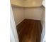 Walk-in closet with hardwood floors offering ample storage space for any wardrobe at 6416 N 78Th Ln, Glendale, AZ 85303