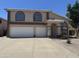 Charming two-story home with a two-car garage and neutral tones, presenting an inviting curb appeal at 6416 N 78Th Ln, Glendale, AZ 85303