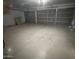 A spacious two-car garage with two door and painted concrete floors at 6416 N 78Th Ln, Glendale, AZ 85303