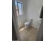 Compact half bathroom featuring a pedestal sink and tile flooring at 6416 N 78Th Ln, Glendale, AZ 85303
